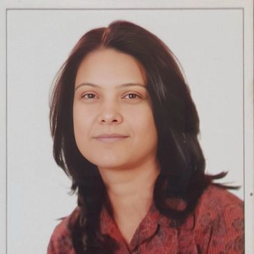 Portrait of a woman with dark hair and a calm expression.