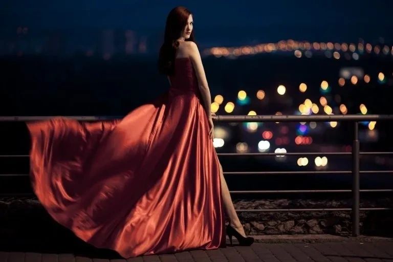 Cover Photo. Elegantly dressed woman on pier.