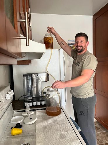 Richard transferring flavored mead to a new carboy