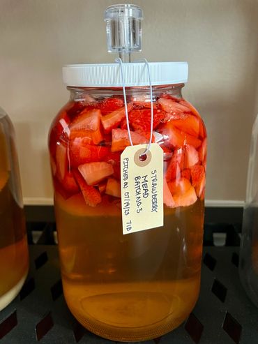 One of our meads being flavored with fresh strawberries
