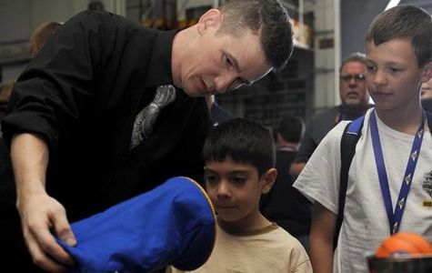 magicain performing the magic bag magic trick illusion during kids event