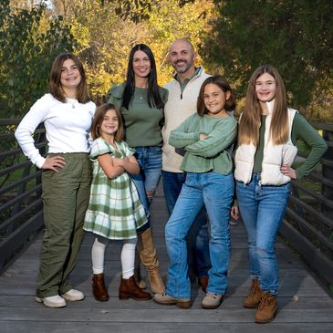 Family portrait with mom, dad, kids in a beautiful park= FUN photoshoot