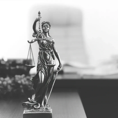 Statue of Lady Justice holding scales and sword.