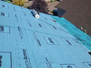 Laying breathable synthetic underlayment, Deck Armor, for added water resistance and breathability.