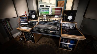 Recording studio control room with an API 1608 analog console and studio desk. The studio mix room.