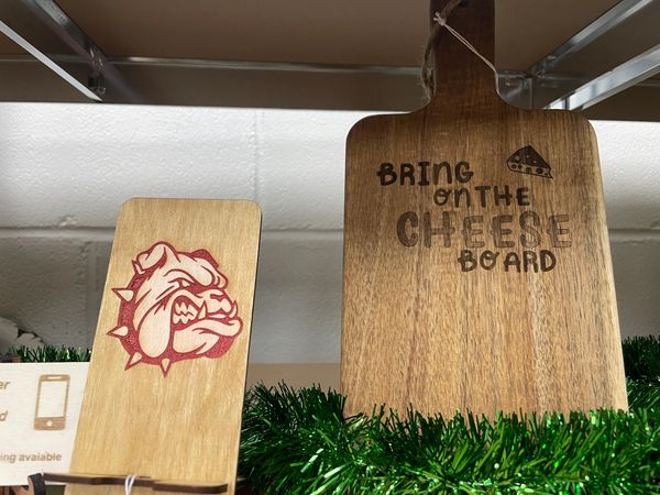 Custom laser cut phone holder with powder coated logo and charcuterie cutting board
