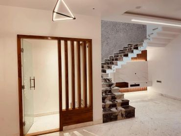 Modern interior with marble stairs and wooden accents.