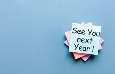 Sticky note on blue background saying 'See You next Year!'