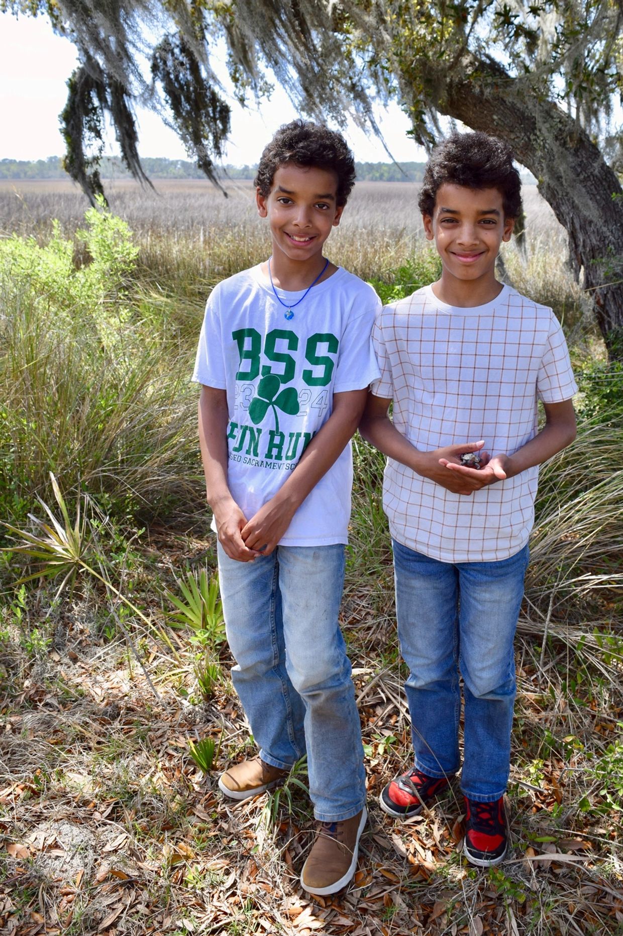 Happy Heroes – Twins Dylan and Forest Acker hold Archibald, a wayward diamondback terrapin whom they