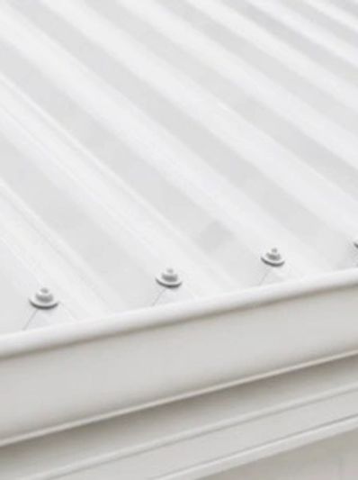 Close-up of a white corrugated metal roof.