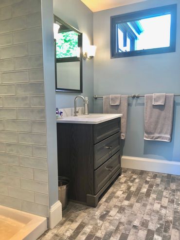 Private ensuite bathroom with 42 inch shower, heated floors in winter