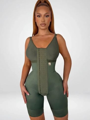 Woman wearing a green waist trainer bodysuit.