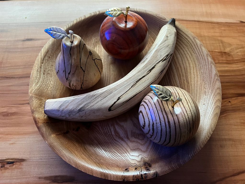 Wooden fruit, apples, pear & banana in a wooden fruit bowl