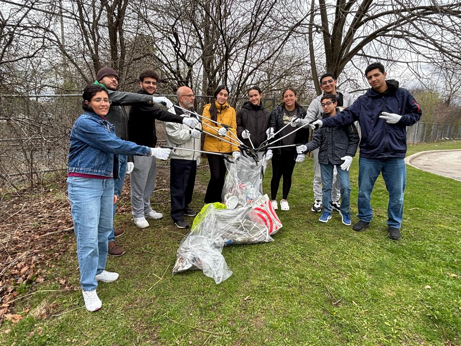 A group of people cleaning up trash