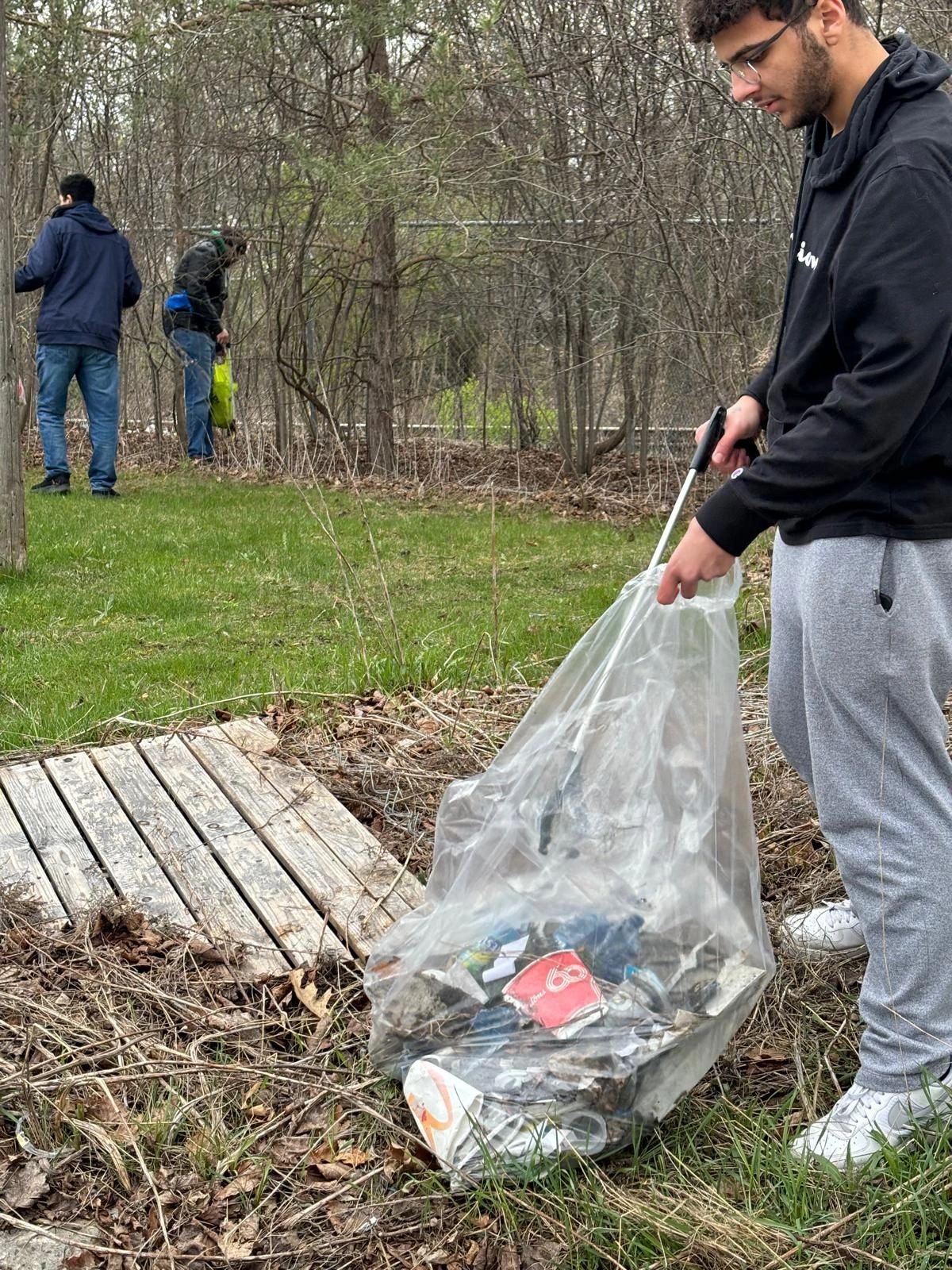 A person cleaning up trash