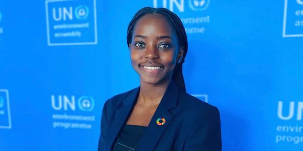 A female youth participant smiling at the UNEA.