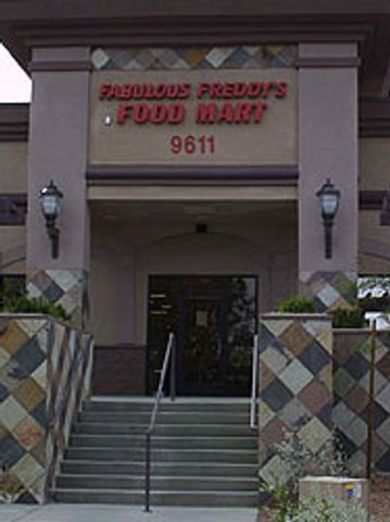 Entrance of Fabulous Freddy's Food Mart with stairs and decorative tiles.