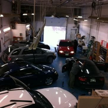 cars inside busy tint shop in toronto