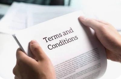 Person reading terms and conditions document.