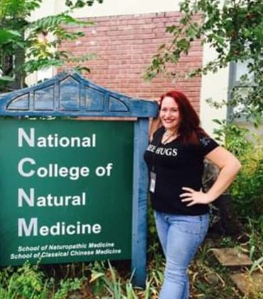 National college of natural medicine presentation picture of founder with sign for college