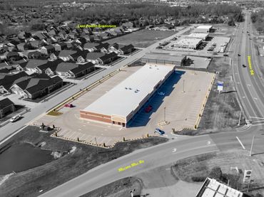 Enhanced drone photos highlight the property and key streets or area features