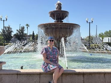 Therapist sitting by a fountain