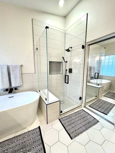  a small shower room along with a bathtub