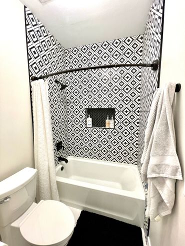 simple bathtub installed on a bathroom