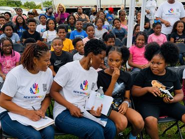 Community event with children and adults together outdoors.