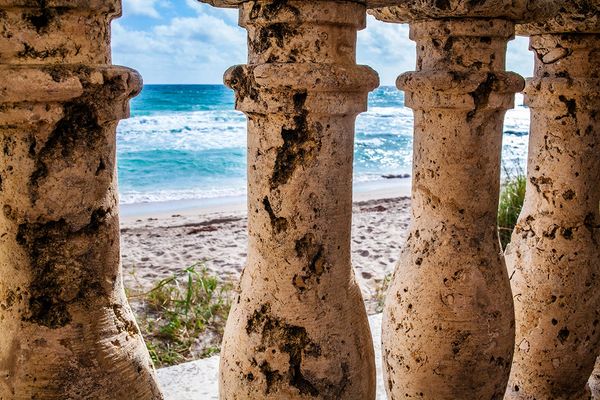 A glance of the seashore through the Worth Avenue clock tower in West Palm Beach FL