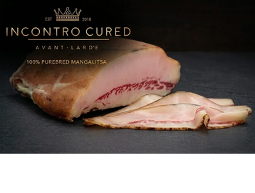 Sliced cured meat labeled Incontro Cured with Mangalitsa pork.