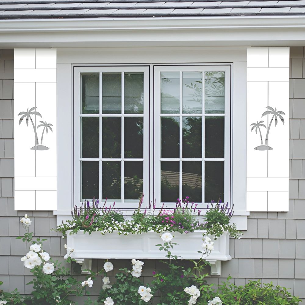 Custom PVC palm tree designed window shutters beatifully flanking a grid window.