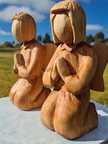 Hand carved wooden kneeling angels