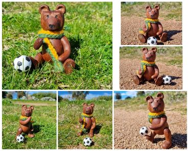 Hand carved jointed wooden bear in Australian coloured scarf with soccer ball