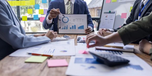 An accountant sharing financial statements to small business owners.