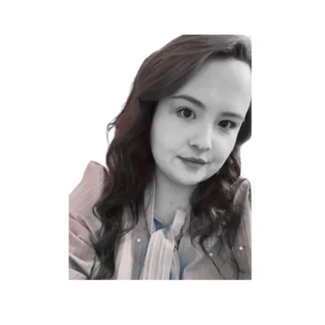 Black and white portrait of a woman with long hair and a patterned blouse.