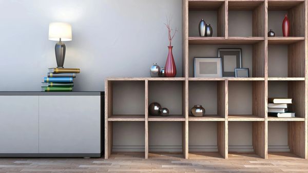 Room with a book shelf and a lamp