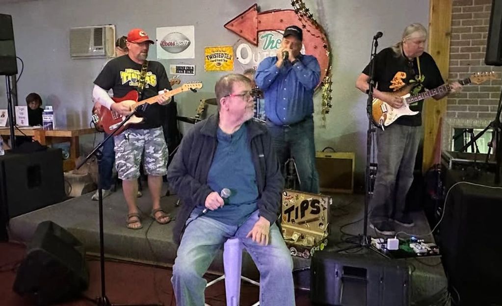 Musicians jamming at the March 2025 MO Blues monthly jam held at the Outpost Bar & Grill ,