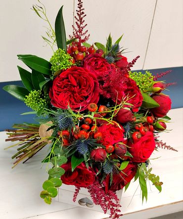 Red Bridal hand tied of red roses, berries and astilbe