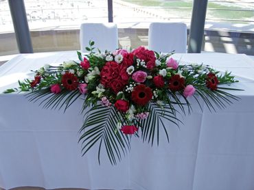 red Hydrangea top table wedding arrangement