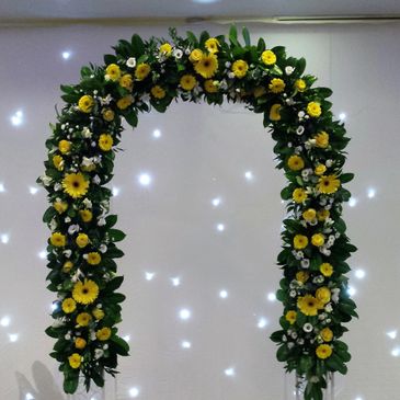 Wedding Arch off yellow Gerberas and yellow Roses