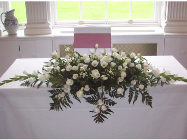 White top table wedding arrangement by Arabella's flowers