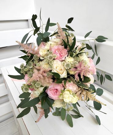 Pink and white bridle hand tied bouquet with eucalyptus foliage