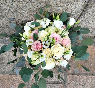 Pink and white rose Hand tied bridal bouquet interwoven with white lisianthus and eucalyptus.