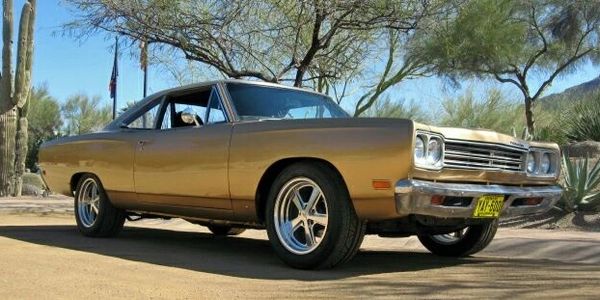 Front three-quarter view of a 1969 Plymouth Belvedere in factory T3 Honey Bronze Metallic.