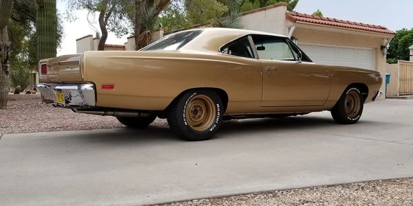 Rear quarter view of a 1969 Plymouth Belvedere in factory T3 Honey Bronze Metallic.