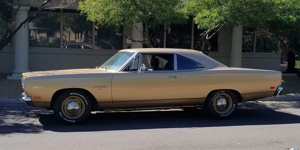 Side profile of a 1969 Plymouth Belvedere in factory T3 Honey Bronze Metallic.
