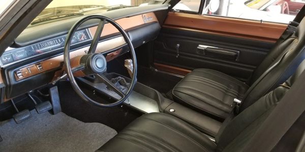 Interior of a 1969 Plymouth Belvedere with X9 black upholstery and T7 Saddle Bronze trim.