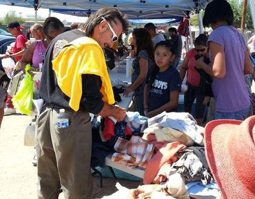 Crowded outdoor community event.