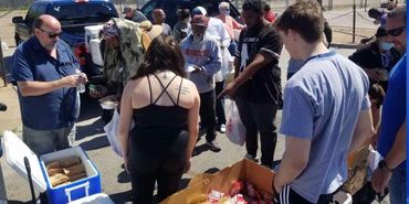 Crowded outdoor community event.